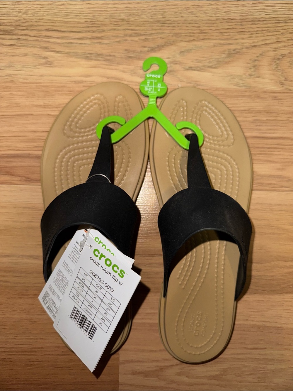 Crocs Women’s Tan and Black Flip Sandals